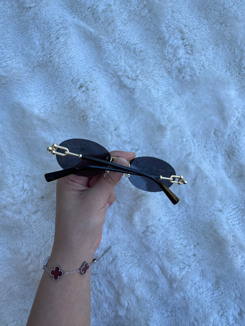 90s black gold oval eyes